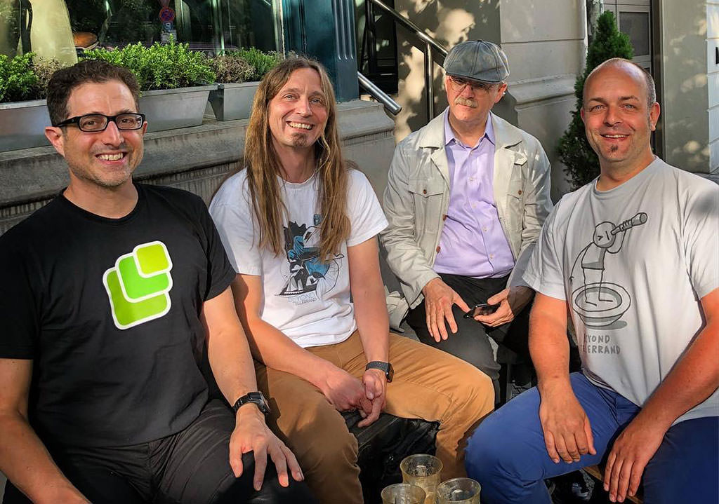 Photo showing Tantek, me, David and Joschi in Berlin. All smiling.